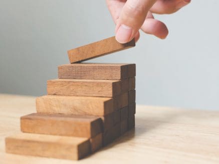 image of wooden blocks creating steps to denote career development