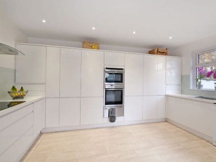 pristine white modern kitchen ideal for home entertaining