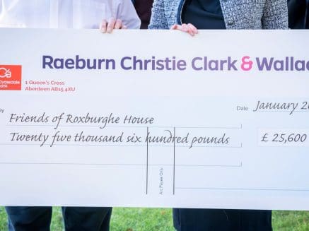 Image of cheque showing funds raised by RCCW for Roxburghe House total is £25,600.