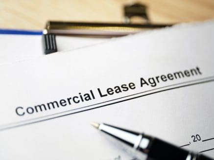 Image of a commercial lease agreement and pen