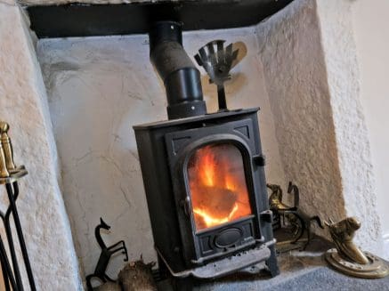 image of a log burner in a sitting room.